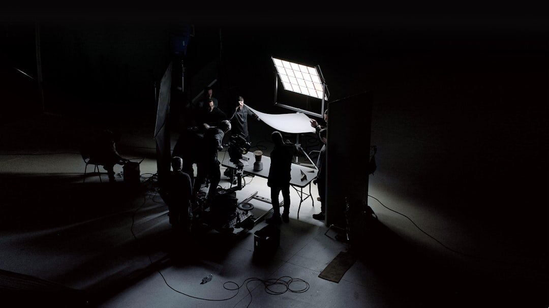 Wide shot of a television studio set with lighting rig and cameras