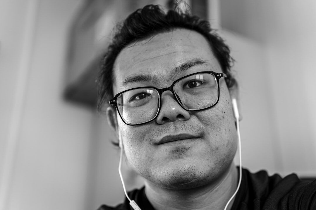 Portrait of a Finnish male broadcast director with glasses and headset