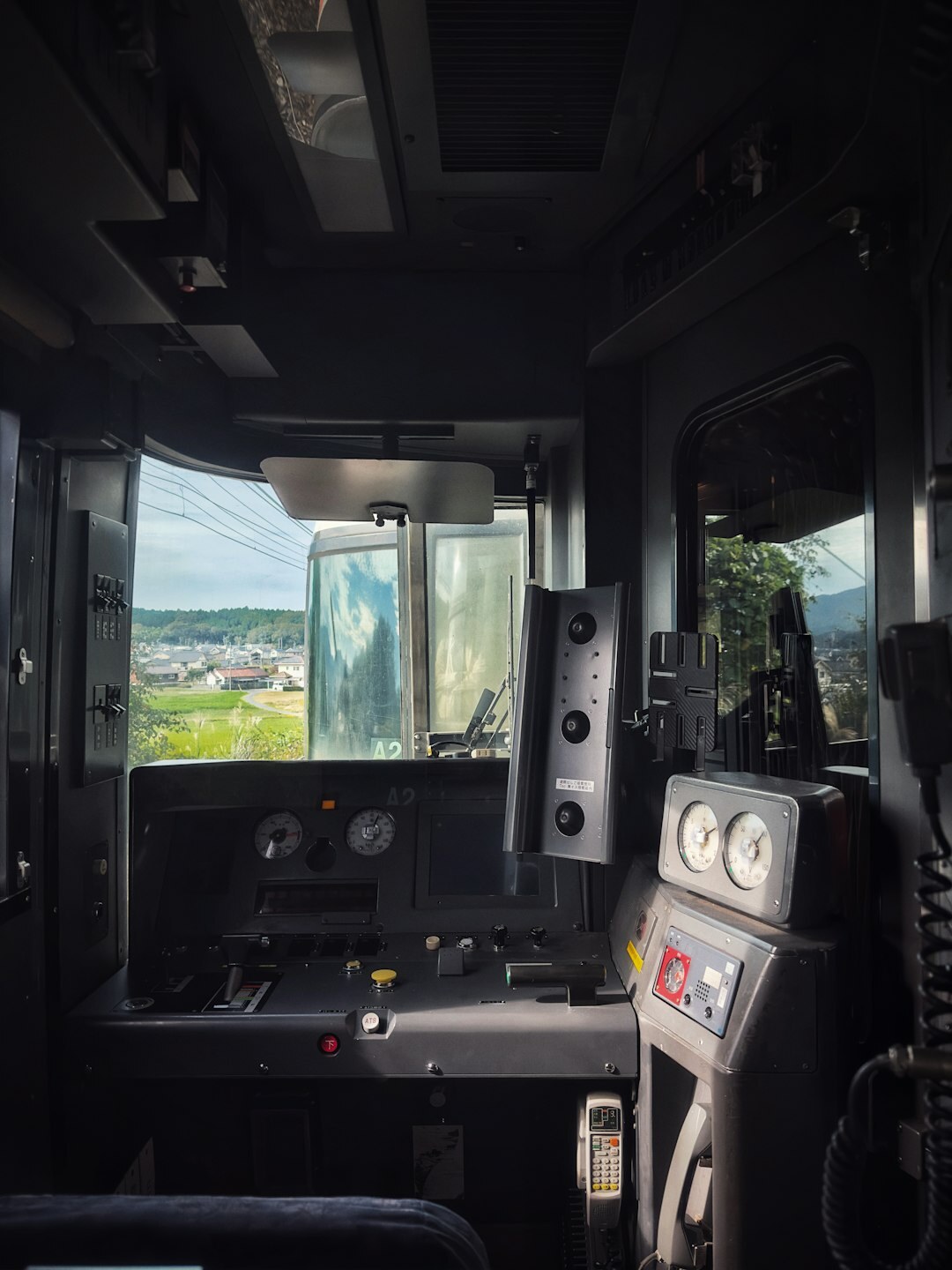 Interior of an outside broadcast truck with switching console and camera feeds