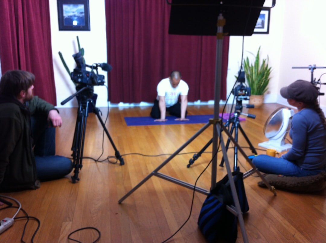 Instructor teaching students how to operate a video switcher in a training studio